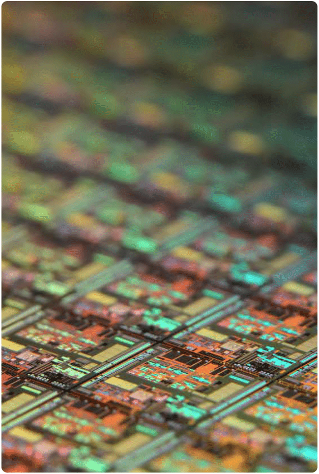 An extreme close up of a circuit board showing each component in vivid color